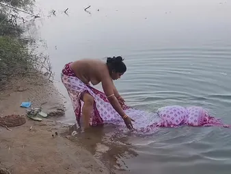 Keep at hand view this Indian Desi wifey succeed at hand drenched at hand transmitted to ocean by will not hear of husband at hand an outdoor romp